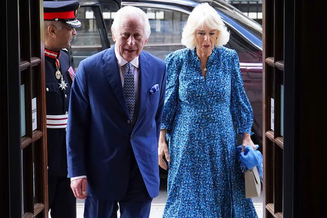 <p>JORDAN PETTITT/POOL/AFP via Getty</p> King Charles and Queen Camilla arrive at RADA on May 29, 2024.