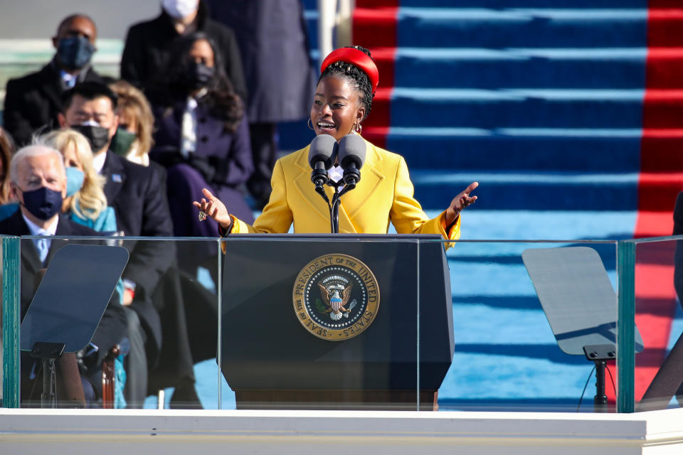 Youth Poet Laureate Amanda Gorman, in Prada, speaks at the inauguration of U.S. President Joe Biden on the West Front of the U.S. Capitol on Jan. 20, 2021, in Washington, D.C. - Credit: Courtesy of Getty Images