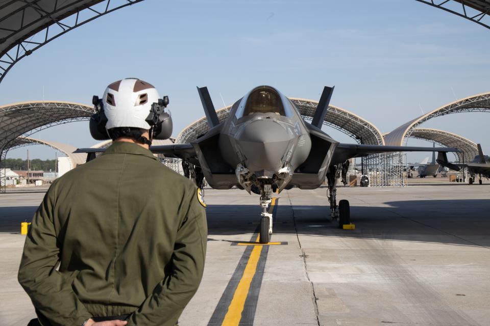 An F-35 aircraft mechanic with Marine Fighter Attack Squadron (VMFA) 542 and an F-35B instructor pilot with Marine Fighter Attack Training Squadron (VMFAT) 501 perform preflight checks on an F-35B Lightning II jet at Marine Corps Air Station Cherry Point, North Carolina, April 20, 2023.
