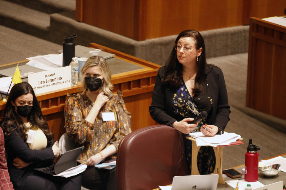 State Sen. Katy Duhigg, top right, D-Albuquerque, guides an hours-long debate on a bill that would shore up abortion access statewide amid a flurry of local anti-abortion ordinances, Tuesday, March 7, 2023, at the Capitol building in Santa Fe, N.M. A 23-15 vote of the Senate nearly ensures the bill will reach the desk of supportive Democratic Gov. Michelle Lujan Grisham. New Mexico has one of the country's most liberal abortion access laws, but two local counties and three cities have recently adopted abortion restrictions that reflect deep-seated opposition to the procedure. (AP Photo/Morgan Lee)