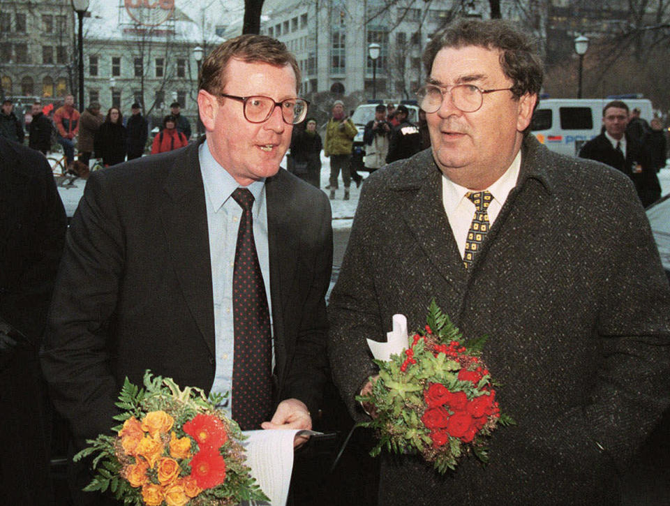 FILE - The 1998 Nobel Peace Prize winners John Hume, right, and David Trimble at the Grand Hotel in Oslo, Dec. 9, 1998. The Nobel Committee praised the pair "for their efforts to find a peaceful solution to the conflict in Northern Ireland" and their roles in delivering the Good Friday accord earlier in the year. David Trimble, a former Northern Ireland first minister who won the Nobel Peace Prize for being a key architect of the Good Friday Agreement that ended decades of conflict, has died, the Ulster Unionist Party said Monday July 25, 2022. He was 77. (AP Photo/Jon Eeg, File)