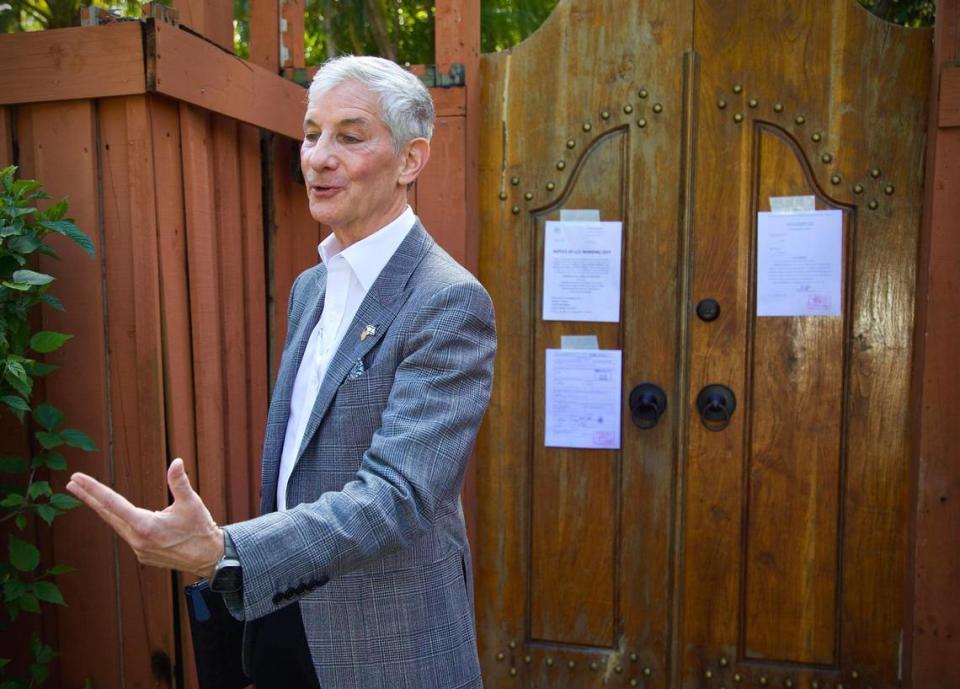 Marc Sarnoff speaks to reporters outside Joe Carollo’s residence in Coconut Grove on Friday, Feb. 2, 2024. U.S. Marshals are moving to seize the property of the Miami commissioner after he lost a civil trial accusing him of misusing his public office.