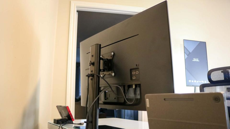 A monitor stand holding up the Samsung M7 Smart Monitor