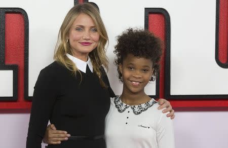 Actress Cameron Diaz and Quvenzhane Wallis pose for photographers during a photocall for their film Annie, in central London December 16, 2014. REUTERS/Neil Hall