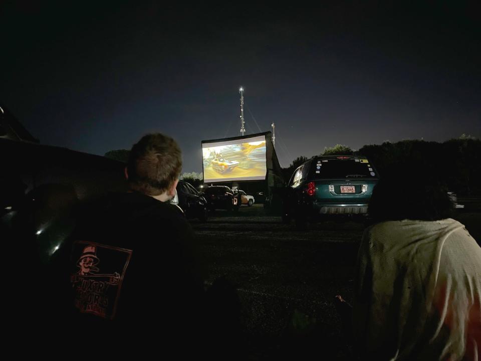 (L-R) Nate Mitchell and Tatiana Veneruso watch "Mad Max: Fury Road" on opening night of the Ciné Drive-In at General Time in Athens, Ga. on Tuesday, June 1, 2021.