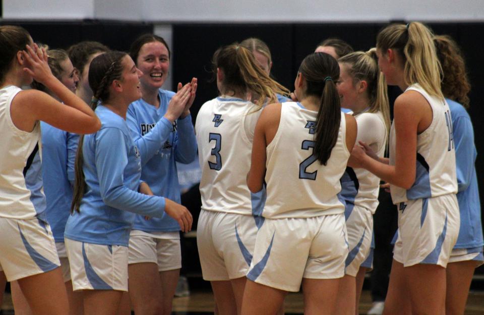 Ponte Vedra players celebrate with guard Morgan Gavazzi (1, third from right) after she scored her 1,000th career point on Jan. 18 against Orange Park.