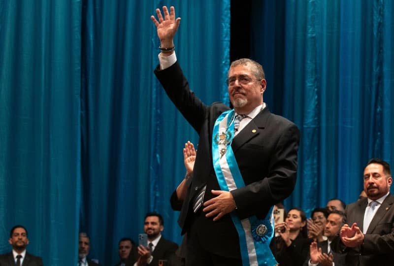 Bernardo Arevalo (C), new president of Guatemala, waves during his inauguration ceremony in the National Palace. Sandra Sebastian/dpa