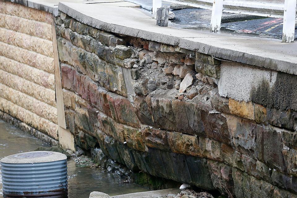 "The retaining wall that exists there on the south side of the creek has been slowly eroding and collapsing," Ashland Mayor Matt Miller said of a parking lot the city is buying. Left unchecked, the erosion could soon cause a dam to form in the stream.