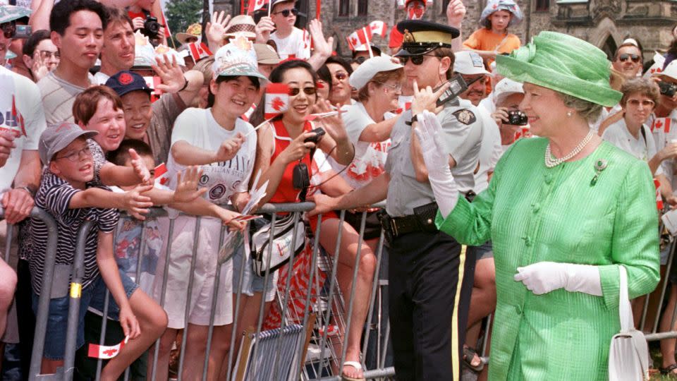 The late Queen Elizabeth II, seen here joining the Canada Day celebrations in Ottawa in 1997, visited Canada 22 times during her reign. - Carlo Allegri/AFP/Getty Images