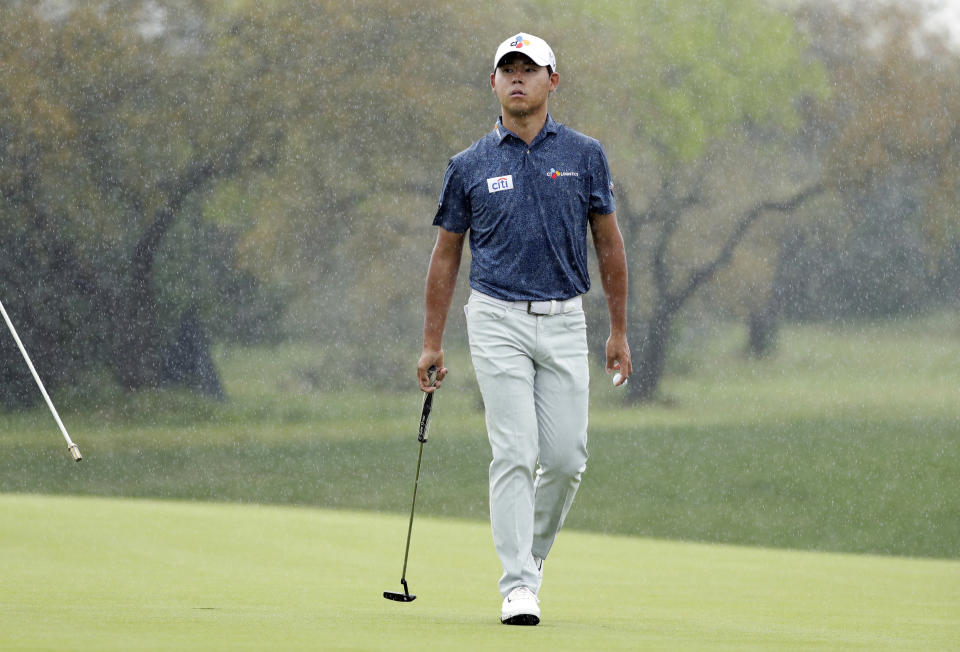 Si Woo Kim walks off the green on the second hole during the third round of the Texas Open golf tournament, Saturday, April 6, 2019, in San Antonio. (AP Photo/Eric Gay)