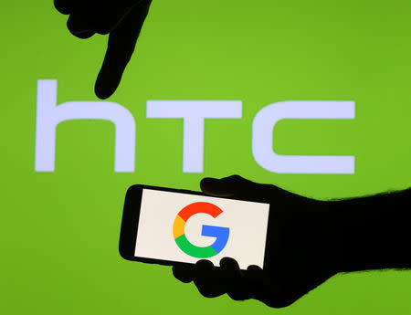 The Google logo is seen on a smartphone in front of a displayed HTC logo in this illustration taken September 21, 2017. REUTERS/Dado Ruvic/Illustration