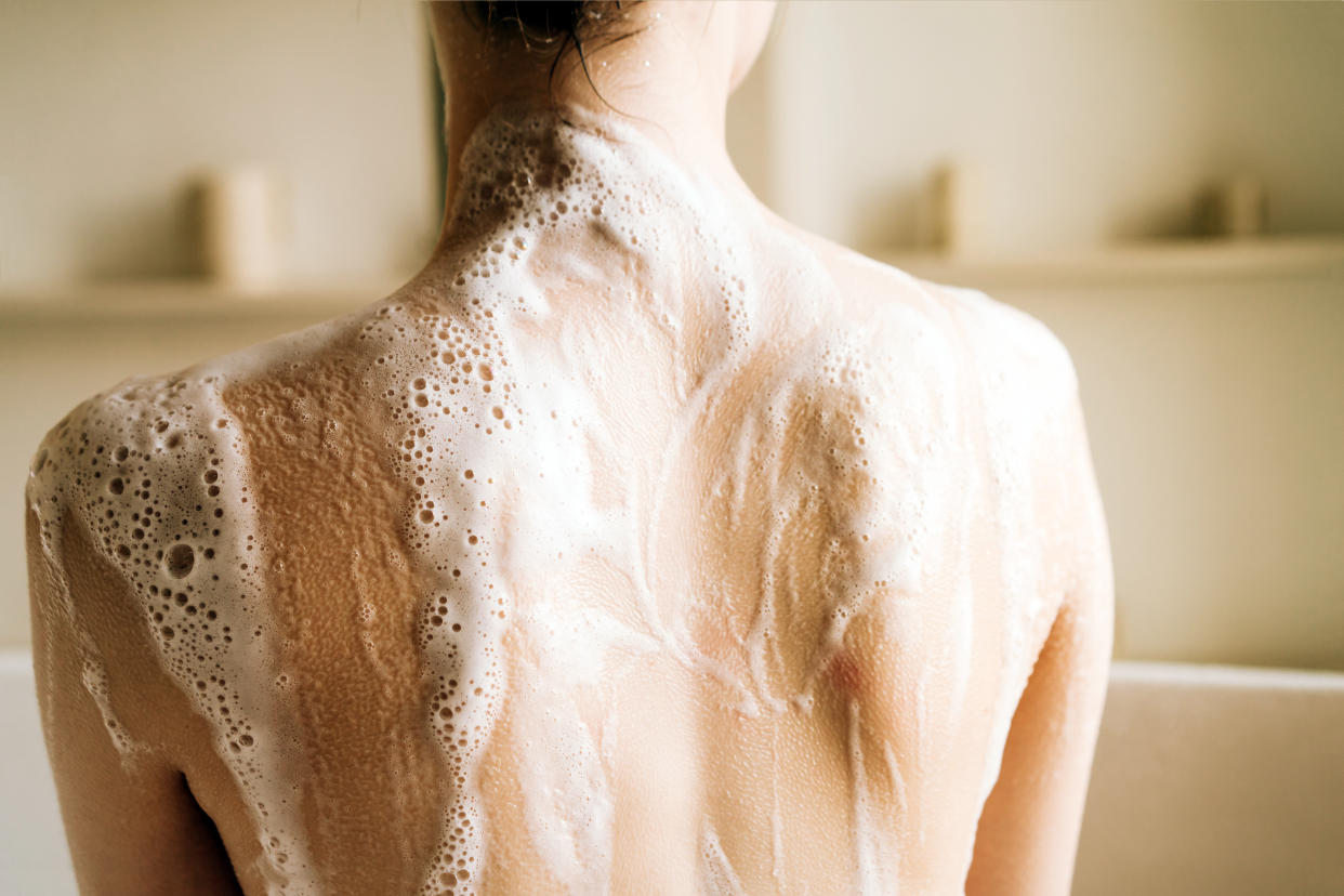 Woman taking a bubble bath. Relaxation and beauty treatments. Natural beauty, daily skincare routine. Moisturizing, cleansing