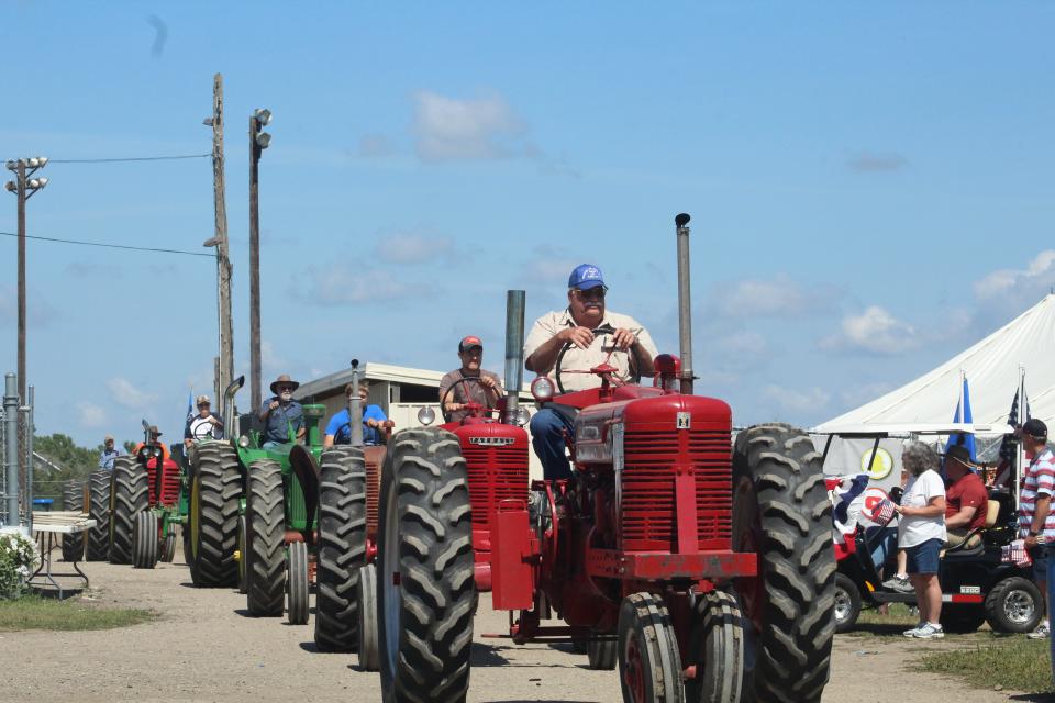 An antique tractor parade preceded an antique tractor pull Sunday afternoon at the Brown County Fair.