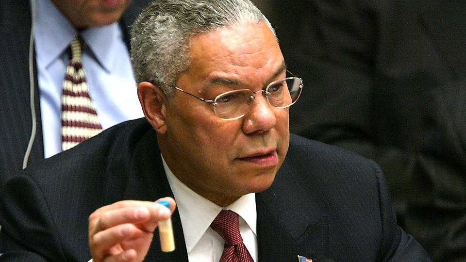 Secretary of State Colin Powell holds a vial representing the small amount of Anthrax  during his address to the U.N. Security Council in New York City, Feb. 5, 2003.  (Photo by Mario Tama/Getty Images)