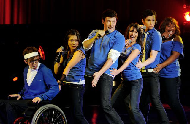 <p>Kevin Winter/Getty</p> (L-R) 'Glee' cast members Kevin McHale, Jenna Ushkowitz, Cory Monteith, Lea Michele, Chris Colfer and Amber Riley