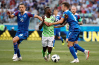 <p>Nigeria’s Kelechi Iheanacho in action with Iceland’s Kari Arnason and Gylfi Sigurdsson </p>