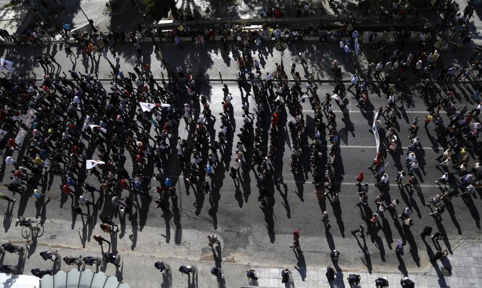 Protesters march to the Greek Parliament in Athens on Tuesday Nov. 6, 2012. Greece's unions are holding their third general strike in six weeks to press dissenters in the country's troubled coalition government not to back a major new austerity program that will doom Greeks to further hardship in a sixth year of recession. Two days of demonstrations are planned to start at 11:00 a.m. (0900GMT) Tuesday, continuing until lawmakers vote late Wednesday on the bill to slash euros13.5 billion ($17.3 billion) from budget spending over two years. (AP Photo/Dimitri Messinis)