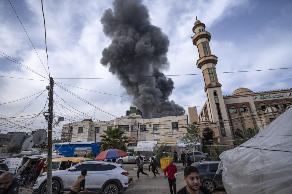 FILE - Smoke rises following an Israeli bombardment on Rafah, southern Gaza Strip, Wednesday, Dec. 20, 2023. Israel is sending top legal minds, including a Holocaust survivor, to The Hague this week to counter allegations that it is committing genocide against Palestinians in Gaza. (AP Photo/Fatima Shbair, File)