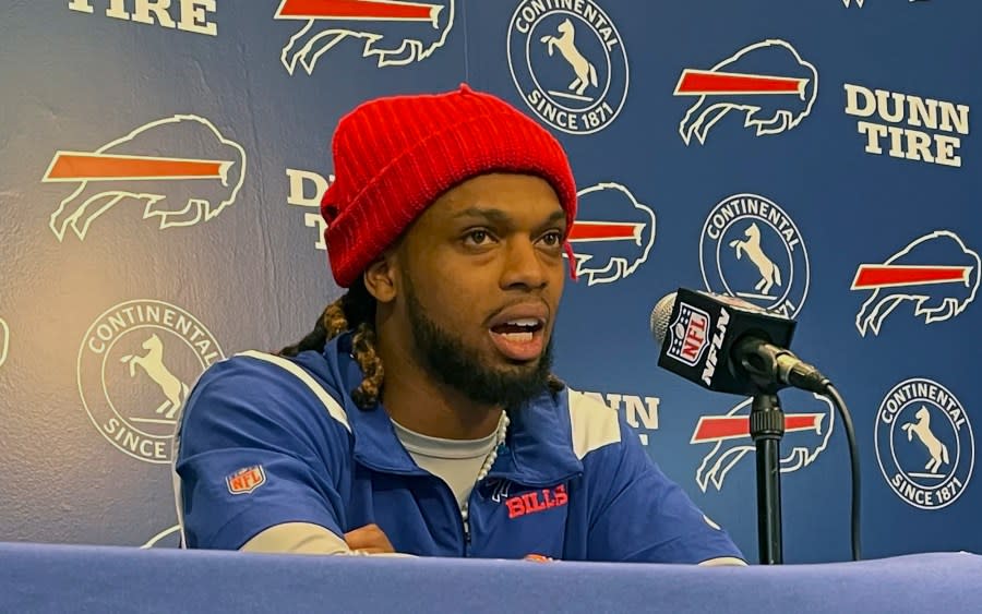 Buffalo Bills safety Damar Hamlin speaks to reporters at the NFL football team's facility in Orchard Park, N.Y., Tuesday, April 18, 2023, saying he plans to resume his football career after being cleared to play more than four months after going into cardiac arrest and needing to be resuscitated on the field during a game at Cincinnati. (AP Photo/John Wawrow)