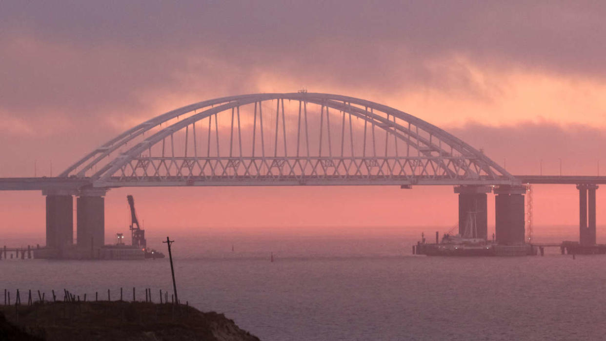 FILE PHOTO: A general view shows a road-and-rail bridge, built to connnect the Russian mainland with the Crimean peninsula, at sunrise in the Kerch Strait, Crimea November 26, 2018. REUTERS/Pavel Rebrov/File Photo