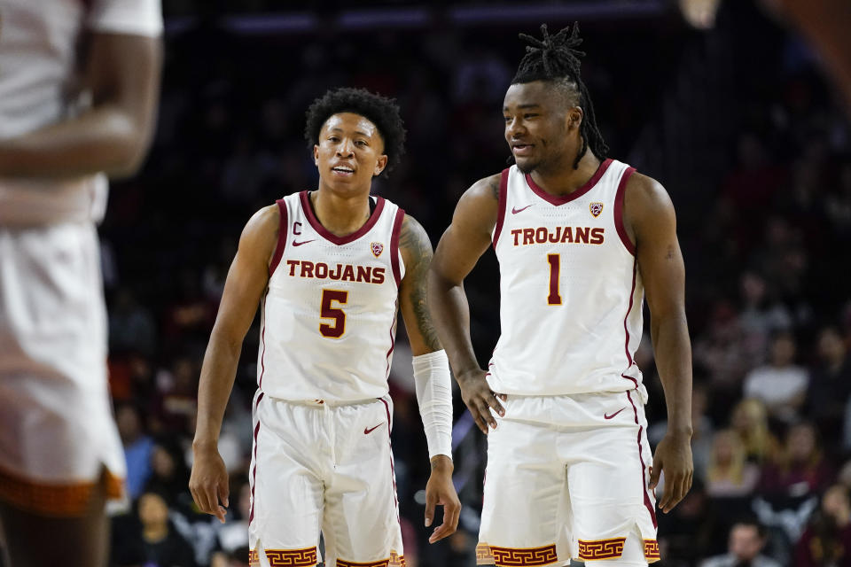 Southern California guards Boogie Ellis, left, and Isaiah Collier stand during a free throw during the first half of an NCAA college basketball game against Brown, Sunday, Nov. 19, 2023, in Los Angeles. (AP Photo/Ryan Sun)