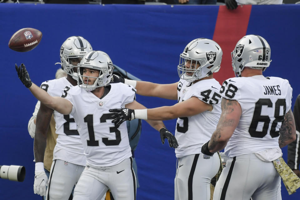 Las Vegas Raiders' Hunter Renfrow (13) celebrates with teammates after catching a pass for a touchdown during the first half of an NFL football game against the New York Giants, Sunday, Nov. 7, 2021, in East Rutherford, N.J. (AP Photo/Bill Kostroun)