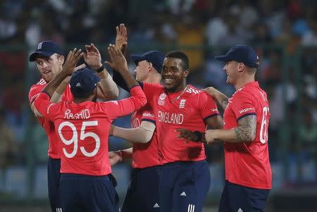 Cricket - Sri Lanka v England - World Twenty20 cricket tournament - New Delhi, 26/03/2016. England's Chris Jordan (2nd R) celebrates with his teammates after taking the wicket of Sri Lanka's Dinesh Chandimal. REUTERS/Adnan Abidi