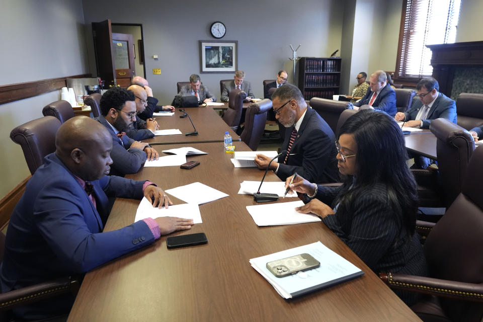 Members of the Mississippi State Senate Judiciary B Committee review legislation that would restore suffrage for some people convicted of felonies in the past, Monday, April 22, 2024, at the state Capitol in Jackson, Miss. The bills that were approved by the committee will be presented before the Senate for its approval. (AP Photo/Rogelio V. Solis)