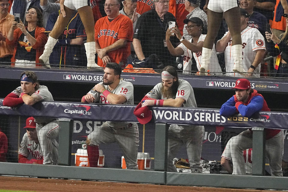 The Philadelphia Phillies watch the Houston Astros celebrate their 4-1 World Series win against the Philadelphia Phillies in Game 6 on Saturday, Nov. 5, 2022, in Houston. (AP Photo/Sue Ogrocki)