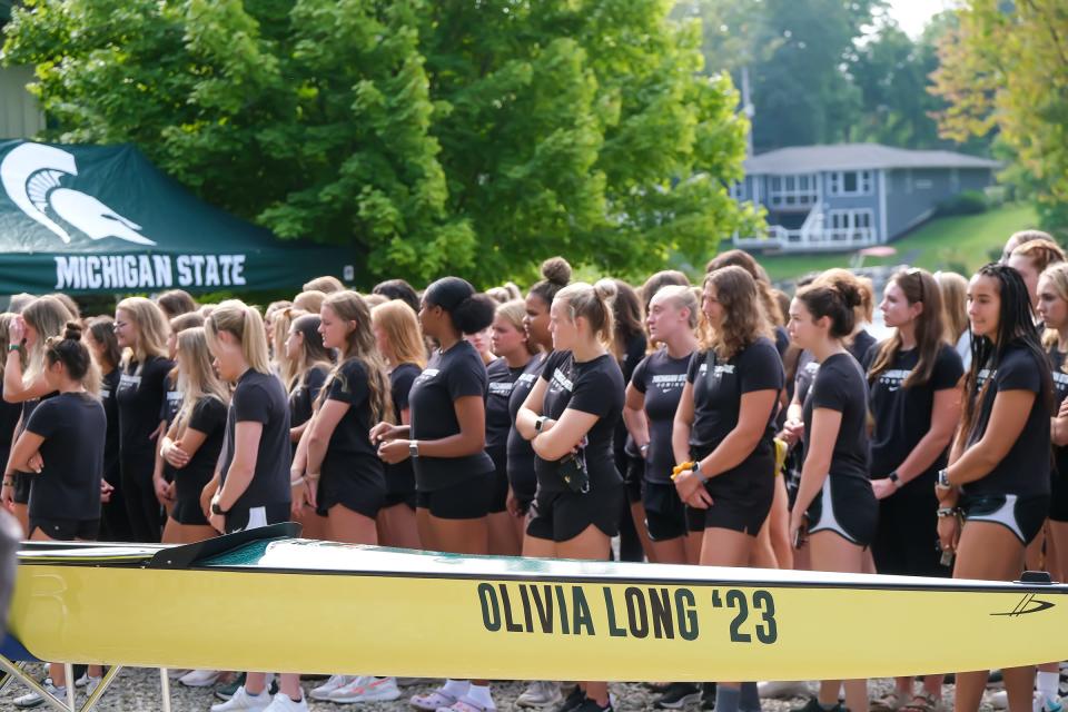 Members of the Michigan State Rowing Team gather at a dedication of a new boat named after former captain Olivia Long Saturday, Sept. 17, 2022. Long died in a car crash in August of 2021. 