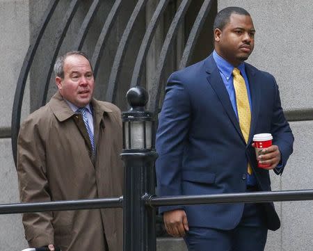 Baltimore Police officer William Porter (R) approaches the court House in Baltimore, Maryland, November 30, 2015. REUTERS/Rob Carr/Pool