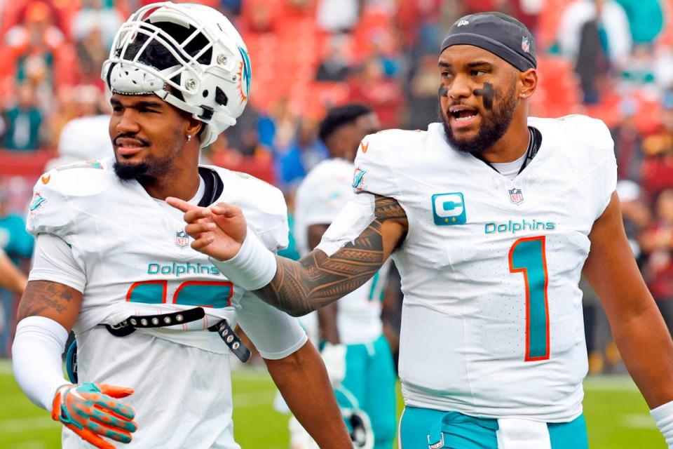 Miami Dolphins quarterback Tua Tagovailoa (1) and wide receiver Jaylen Waddle (17) walk off the field to the locker room after warmups in preperation for the game against the Washington Commanders at FedEx Field in Landover, Maryland on Sunday, December 3, 2023.