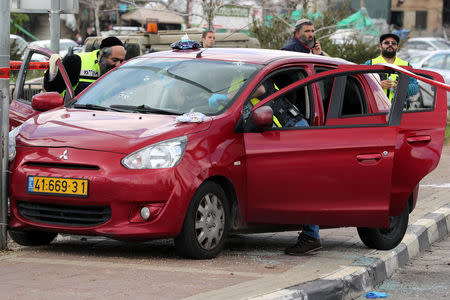 Israeli forensic police inspect the scene of Palestinian shooting attack near the Jewish settlement of Ariel, in the occupied West Bank March 17, 2019. REUTERS/Ammar Awad