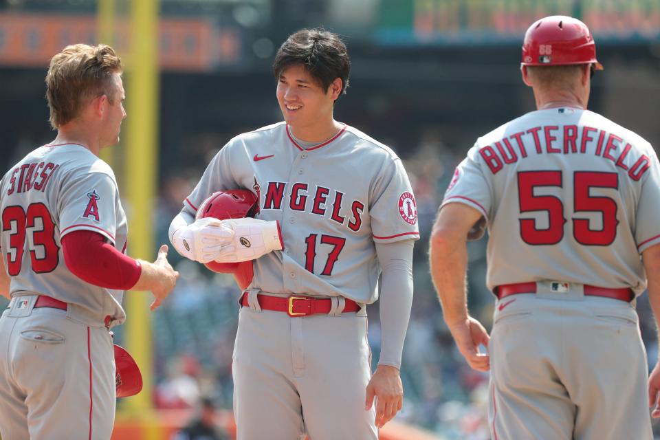 Los Angeles Angels  Max Stassi (33), Shohei Ohtani (17) and infield/third base coach Brian Butterfield (55) talk during a break in the action against the Detroit Tigers at Comerica Park Thursday, August 19, 2021. 