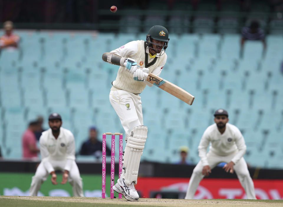 Australia's Mitchell Starc lets a high ball go past on day 4 of their cricket test match against India in Sydney, Sunday, Jan. 6, 2019. (AP Photo/Rick Rycroft)