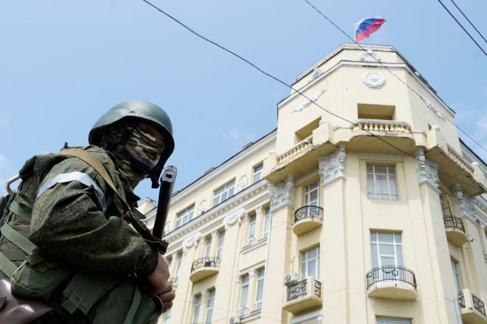 A Wagner Group mercenary stands guard outside the headquarters of the Russian Southern Military District in the city of Rostov-on-Don, on June 24, 2023. P(Photo by STRINGER/AFP via Getty Images)