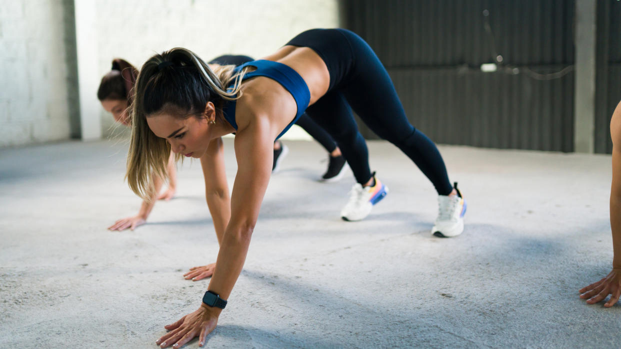 A photo of a woman doing a HIIT workout. 