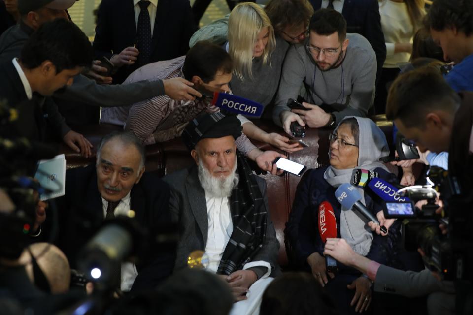 Participants of the conference on Afghanistan including representatives of the Afghan authorities and the Taliban speak to journalists in Moscow, Russia, Friday, Nov. 9, 2018. The conference marks Moscow's attempt to get the Afghan authorities and the Taliban together at a table. The U.S. Embassy in Moscow has sent a diplomat to observe the discussions. (AP Photo/Pavel Golovkin)