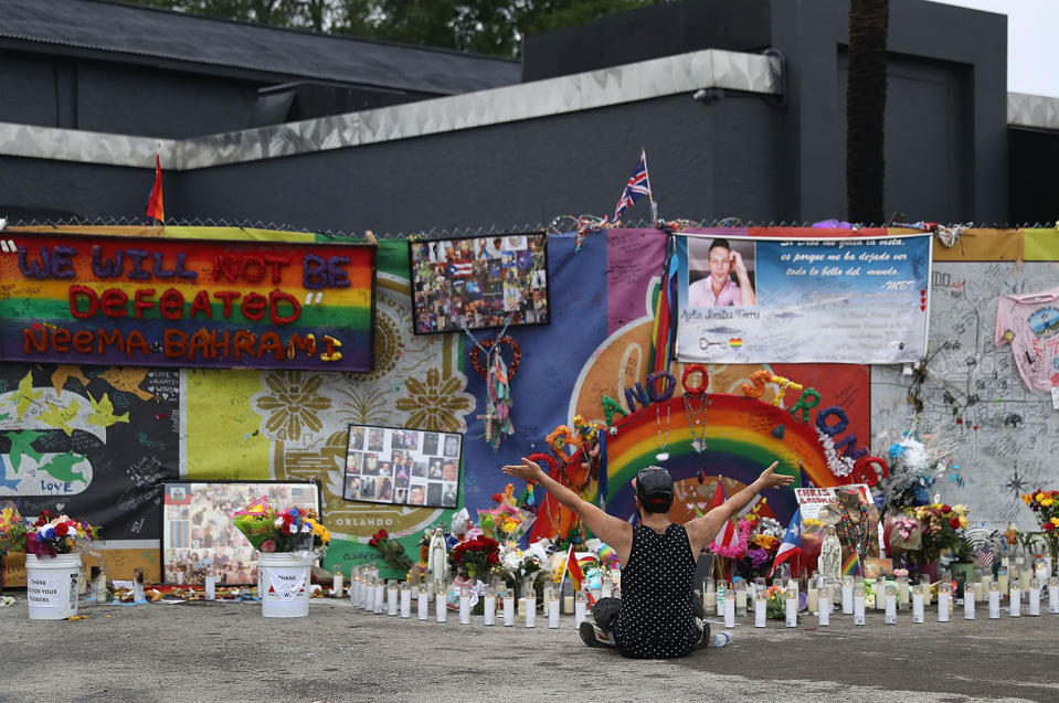 <p>Jose Ramirez who survived the mass shooting at the Pulse gay nightclub reacts as he visits the site one year after the shooting on June 12, 2017 in Orlando, Florida. (Joe Raedle/Getty Images) </p>