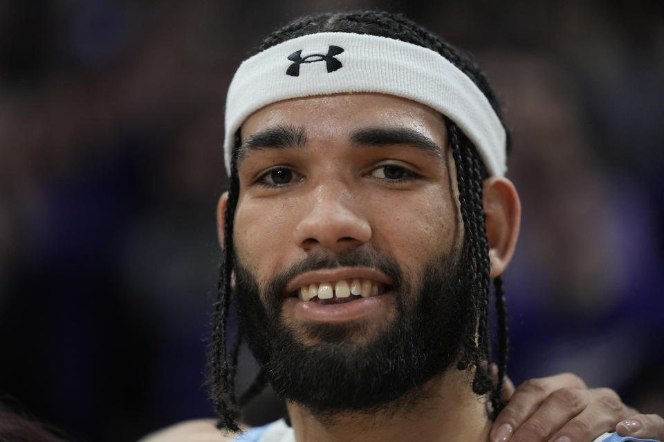 FILE - Northwestern guard Boo Buie smiles as he is honored after becoming Northwestern's all-time leading scorer, following the team's NCAA college basketball game against Michigan, Thursday, Feb. 22, 2024, in Evanston, Ill. Northwestern won 76-62. Buie was selected to the AP All-Big Ten first team in voting released Tuesday, March 12, 2024. (AP Photo/Erin Hooley, File)