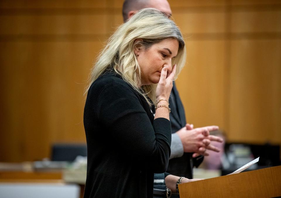 Sarah Baylis wipes a tear as she tells the jury about her in-laws Edie and David Henderson.