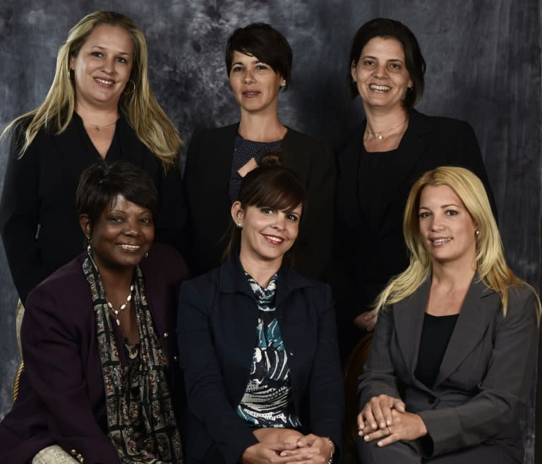 (L-R, back) Cuban businesswomen Gretel de la Rosa, Sandra Lidice Aldama and Nidialys Acosta, and (L-R, front) Caridad Luisa Montana, Yamina Vicente Prado and Marianela Perez Benitez at the Women's Forum in Mexico City on April 27, 2016