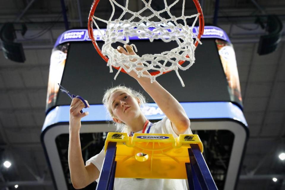 Sacred Heart’s Josie Gilvin, who was named MVP of the Sweet 16, took her piece of the net during the Valkyries’ championship celebration.