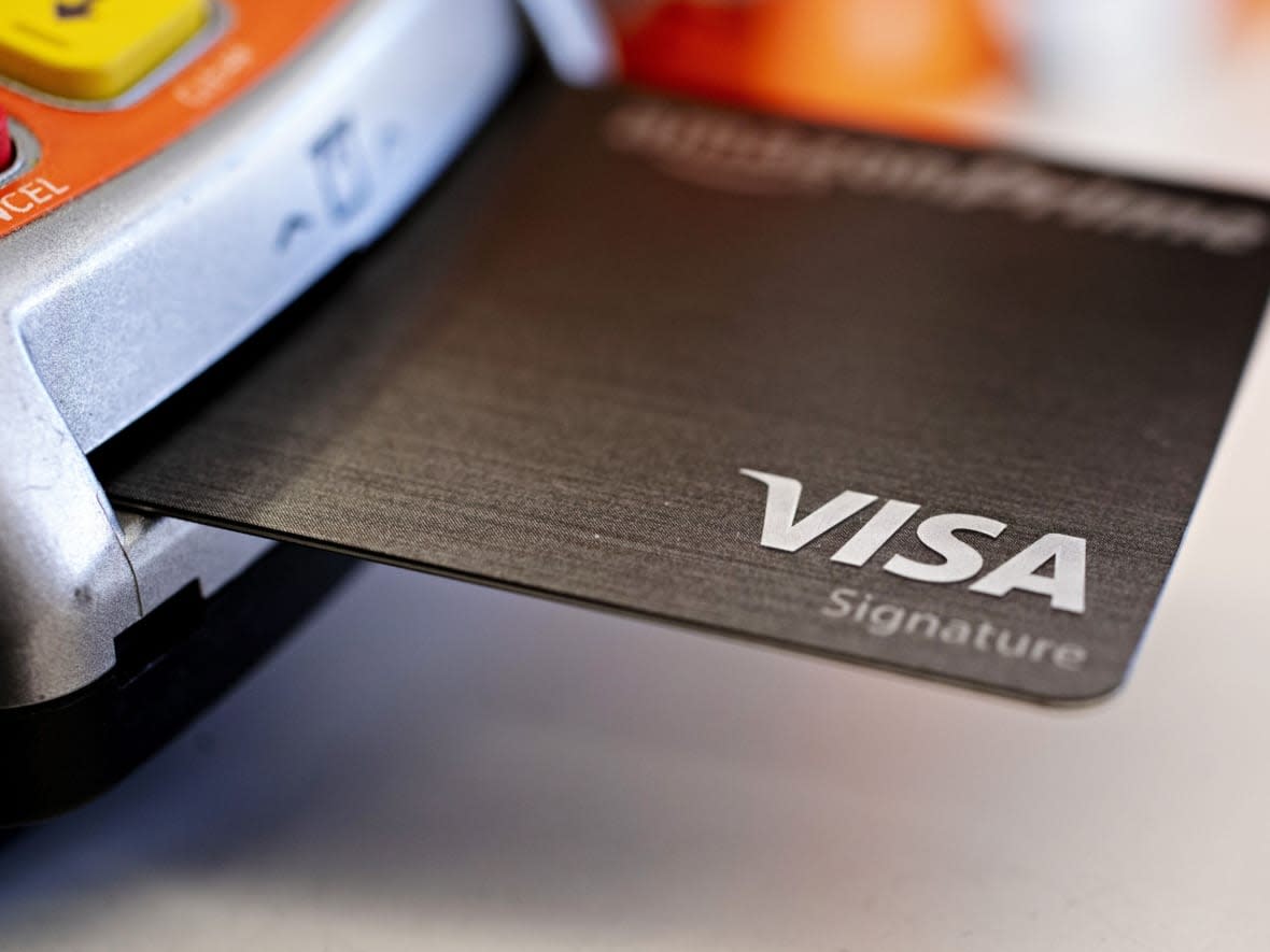 Visa has agreed to lower the interchange fee it charges on its cards in Canada to under one per cent. (Daniel Acker/Bloomberg - image credit)