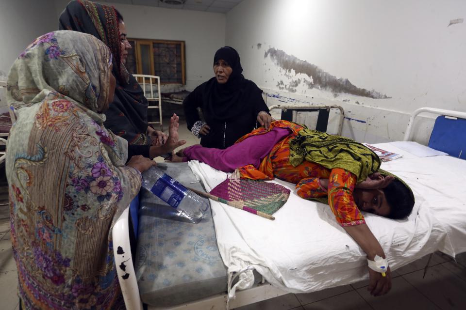 FILE - A pregnant woman lies in her hospital bed for treatment after fleeing her flood-hit home, in Larkana District, of Sindh, Pakistan, Sept. 8, 2022. Pregnant women are struggling to get care after Pakistan’s unprecedented flooding, which inundated a third of the country at its height and drove millions from their homes. The UN says around 130,000 pregnant women in flood-hit areas require urgent healthcare and more than 2,000 are giving birth every day, most in unsafe conditions. (AP Photo/Fareed Khan, File)