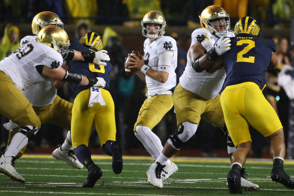 ANN ARBOR, MICHIGAN - OCTOBER 26: Ian Book #12 of the Notre Dame Fighting Irish looks to throw a first half pass against the Michigan Wolverines at Michigan Stadium on October 26, 2019 in Ann Arbor, Michigan. (Photo by Gregory Shamus/Getty Images)