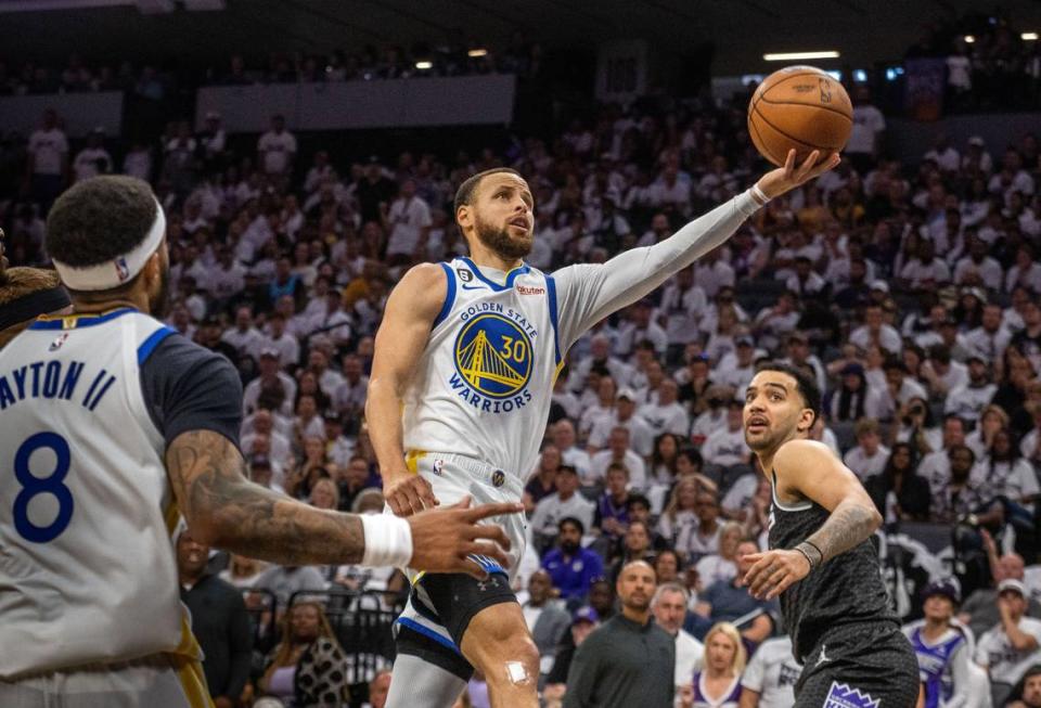 Golden State Warriors guard Stephen Curry (30) drives to the basket and scores two of his 50 points during Game 7 of the first-round NBA playoff series at Golden 1 Center on Sunday, April 30, 2023.