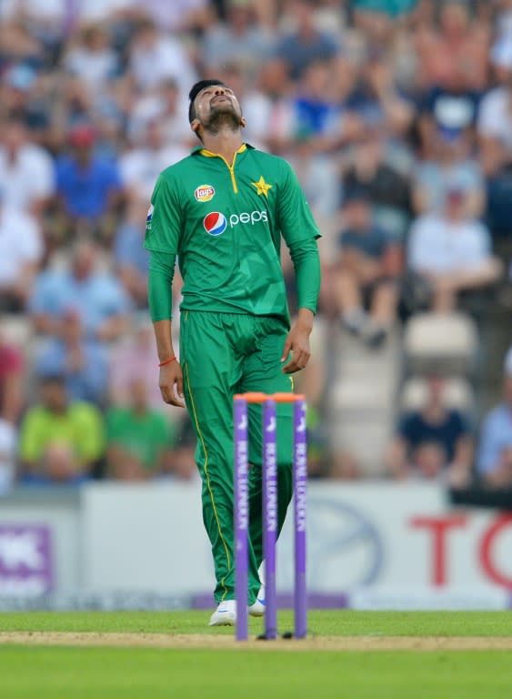 Pakistan's Mohammad Amir reacts after teammate Sarfraz Ahmed dropped a catch during the first one day international (ODI) cricket match between England and Pakistan at The Ageas Bowl cricket ground in Southampton, southern England, on August 24, 2016