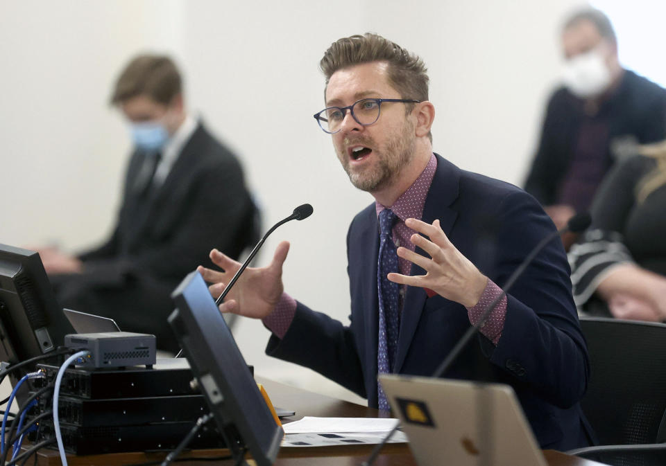 FILE - In this Feb. 11, 2021 file photo, Troy Williams, Equality Utah executive director, speaks during a House Education Committee meeting at the State Office Building in Salt Lake City. Utah lawmakers have advanced a revised proposal about setting new rules governing the participation of transgender athletes in high school sports. The proposal would allow a group of health professionals and others appointed by the state's Republican Legislature to decide which transgender athletes can play women's sports based on physical traits and characteristics affected by puberty. Utah is among a larger group of Republican-led states weighing new rules governing transgender student-athletes. (Kristin Murphy/The Deseret News via AP, File)