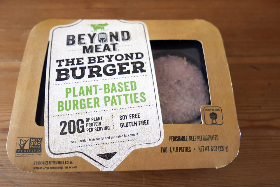 FILE - In this June 26, 2019, file photo, a package of meatless burgers are seen in Orlando, Fla. In a very limited test in Canada, McDonald's said Thursday, Sept. 26, that it's introducing the PLT, or the plant, lettuce and tomato burger. It will be available for 12 weeks in 28 restaurants in Southwestern Ontario by the end of the month. (AP Photo/John Raoux, File)